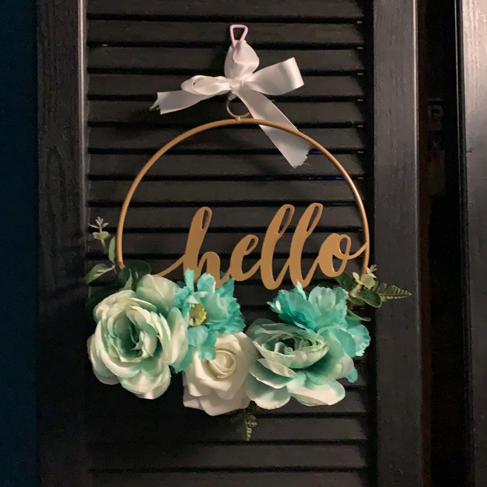 Metal “hello” wreath with flowers